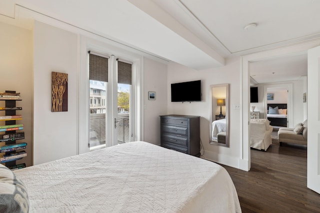 bedroom with baseboards and dark wood finished floors