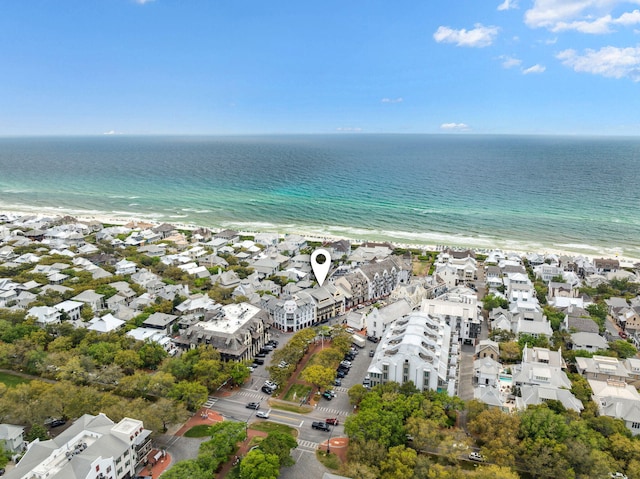 bird's eye view with a water view and a view of the beach