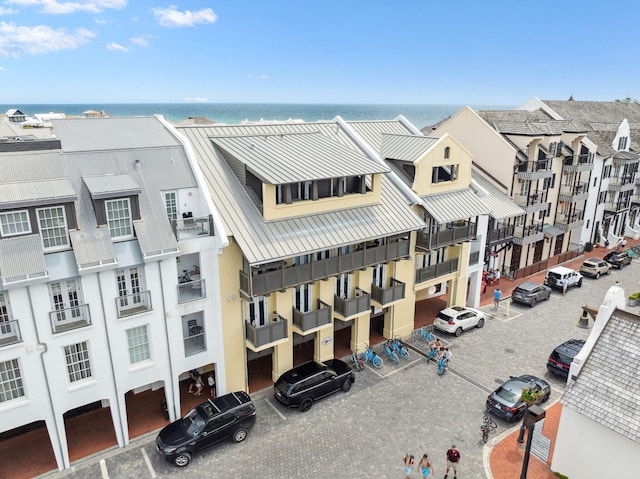 birds eye view of property with a water view