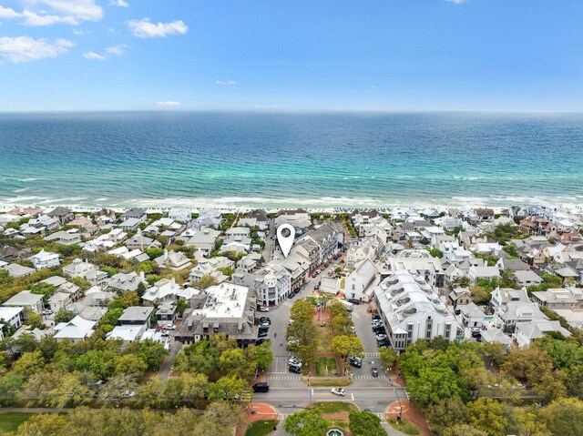 aerial view featuring a water view, a residential view, and a view of the beach