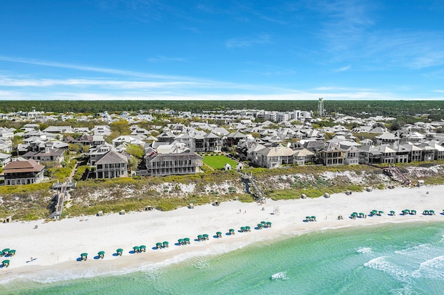 drone / aerial view with a residential view, a view of the beach, and a water view