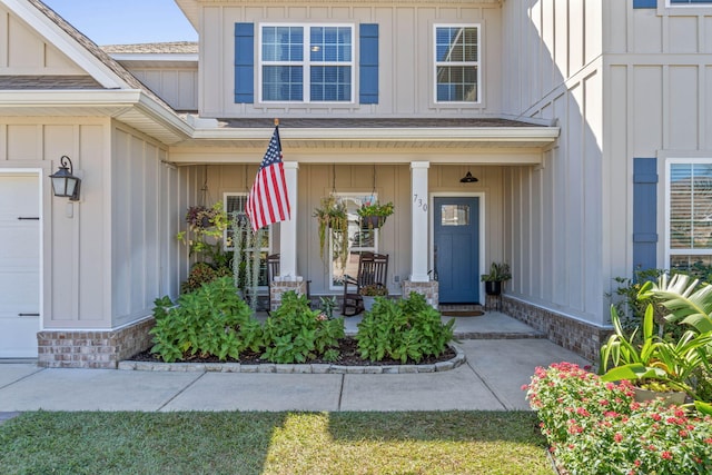 730 Cornelia St, Freeport, FL 32439 - entrance to property featuring board and batten siding and covered porch