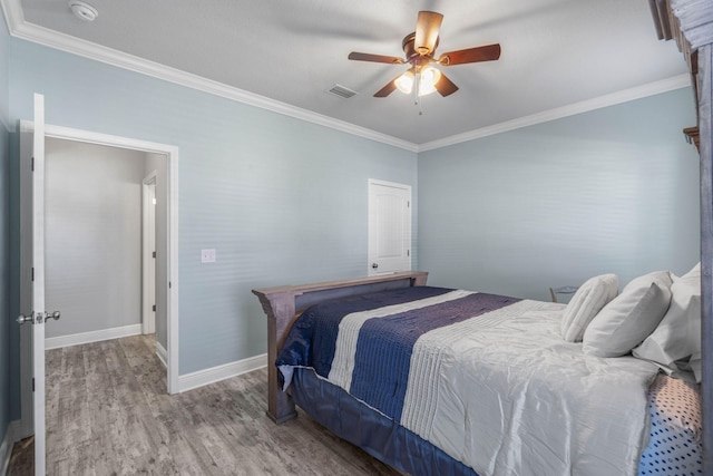 730 Cornelia St, Freeport, FL 32439 - bedroom featuring wood finished floors, crown molding, baseboards, and a ceiling fan