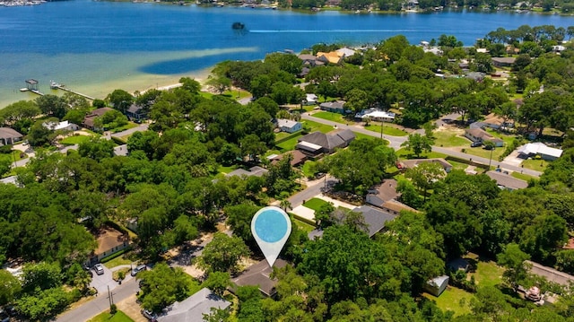 birds eye view of property with a water view and a residential view