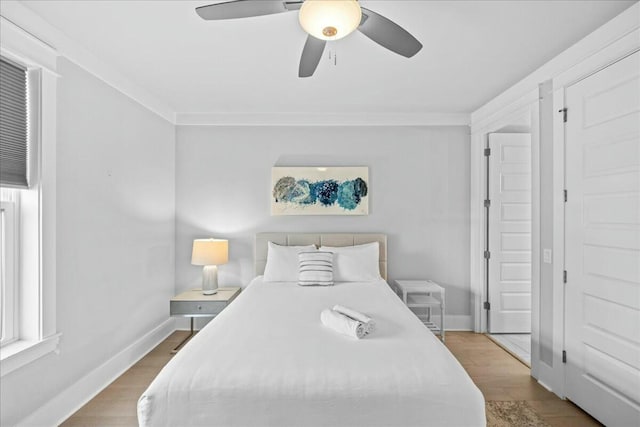 186 Ciboney St, Miramar Beach, FL 32550 - bedroom featuring baseboards, a ceiling fan, and wood finished floors
