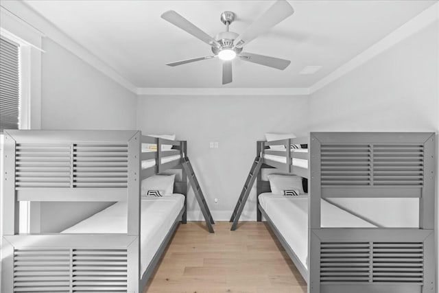 186 Ciboney St, Miramar Beach, FL 32550 - bedroom featuring ornamental molding, baseboards, a ceiling fan, and wood finished floors