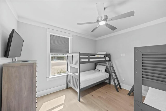 186 Ciboney St, Miramar Beach, FL 32550 - bedroom with baseboards, crown molding, a ceiling fan, and wood finished floors