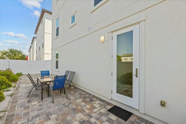 186 Ciboney St, Miramar Beach, FL 32550 - view of patio featuring outdoor dining area and fence