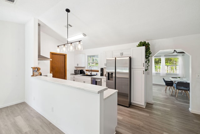 kitchen with appliances with stainless steel finishes, ceiling fan, a sink, and plenty of natural light
