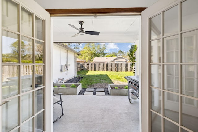 exterior space with french doors, ceiling fan, and carpet