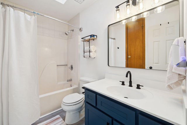 bathroom featuring shower / tub combo with curtain, vanity, and toilet