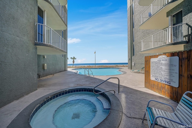10509 Front Beach Rd Unit 406, Panama City Beach, FL 32407 - pool with a patio and a hot tub