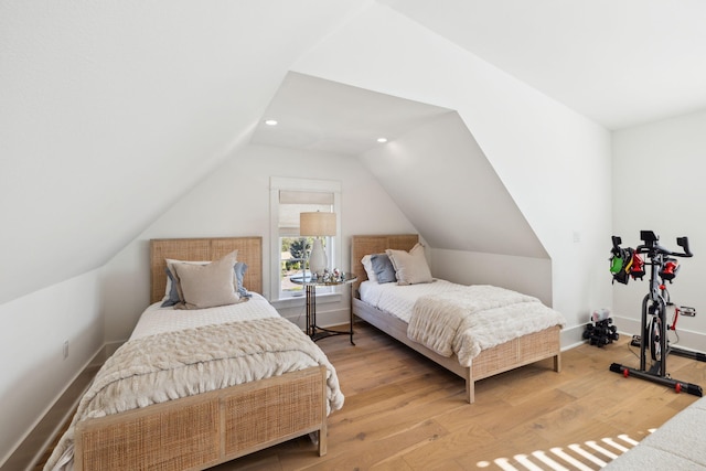 bedroom featuring recessed lighting, light wood-style flooring, baseboards, and vaulted ceiling