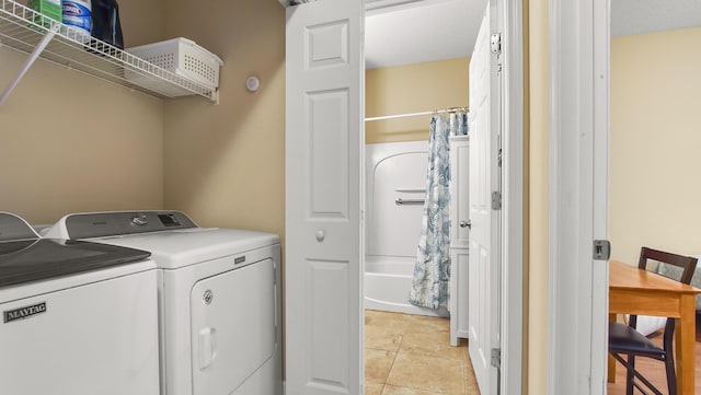 317 Turtle Cv, Panama City Beach, FL 32413 - laundry area with laundry area, light tile patterned flooring, and washing machine and dryer