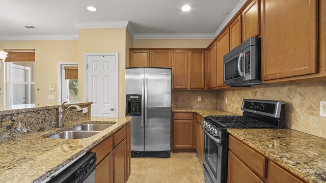 317 Turtle Cv, Panama City Beach, FL 32413 - kitchen with stainless steel appliances, visible vents, a sink, and backsplash