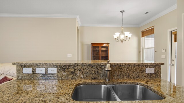 317 Turtle Cv, Panama City Beach, FL 32413 - kitchen featuring crown molding, a sink, visible vents, and a notable chandelier