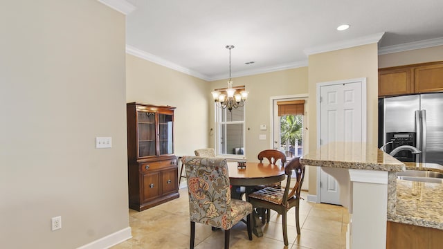 317 Turtle Cv, Panama City Beach, FL 32413 - dining area featuring a chandelier, light tile patterned floors, baseboards, and crown molding