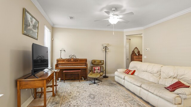 317 Turtle Cv, Panama City Beach, FL 32413 - living area with crown molding, visible vents, ceiling fan, and baseboards