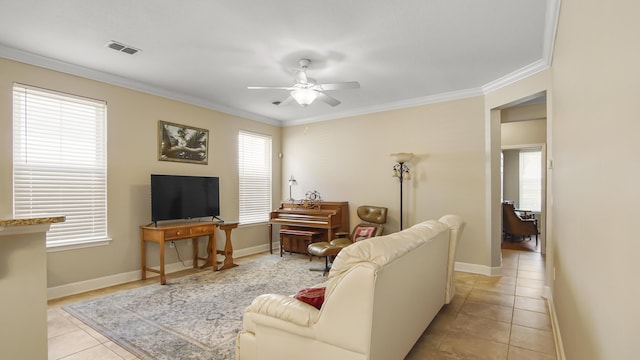 317 Turtle Cv, Panama City Beach, FL 32413 - living room with a wealth of natural light, a ceiling fan, and crown molding