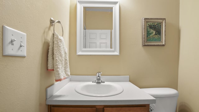 317 Turtle Cv, Panama City Beach, FL 32413 - half bathroom featuring toilet and vanity