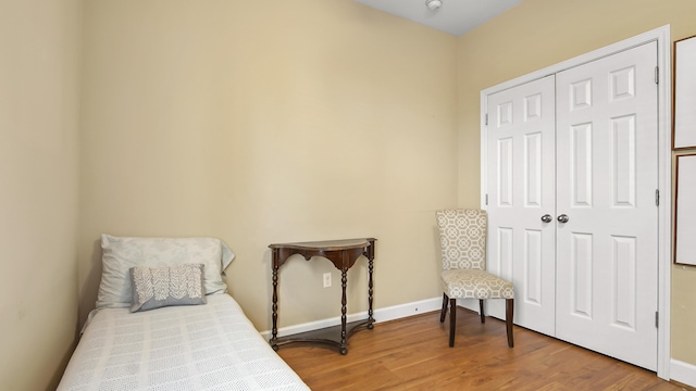 317 Turtle Cv, Panama City Beach, FL 32413 - bedroom with a closet, baseboards, and wood finished floors