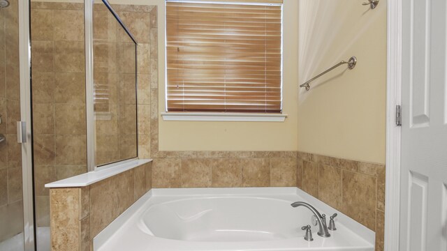 317 Turtle Cv, Panama City Beach, FL 32413 - bathroom featuring a bath and a shower stall