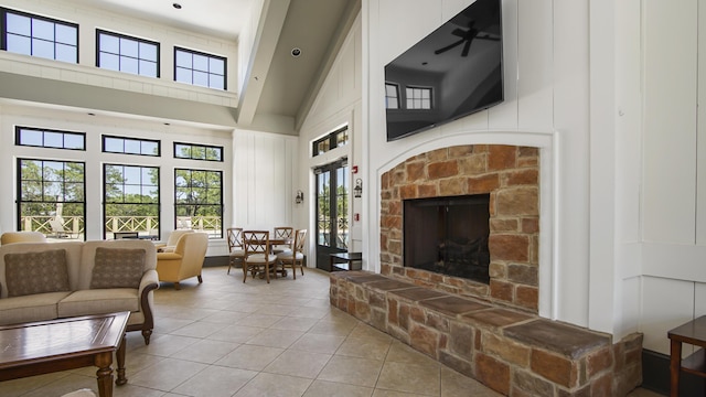 317 Turtle Cv, Panama City Beach, FL 32413 - tiled living room with a fireplace and a high ceiling