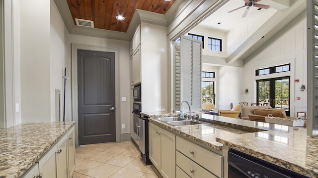 317 Turtle Cv, Panama City Beach, FL 32413 - kitchen featuring light tile patterned floors, a sink, ornamental molding, ceiling fan, and black appliances