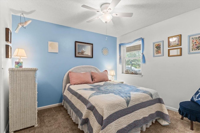 bedroom featuring carpet floors, baseboards, and a textured ceiling
