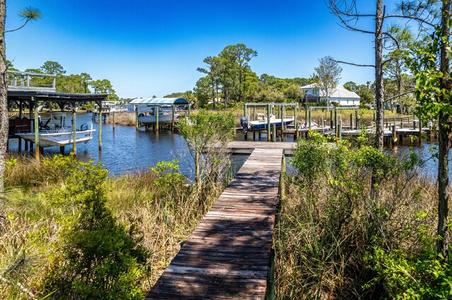 1158 Mack Bayou Rd, Santa Rosa Beach, FL 32459 - dock area featuring a water view and boat lift