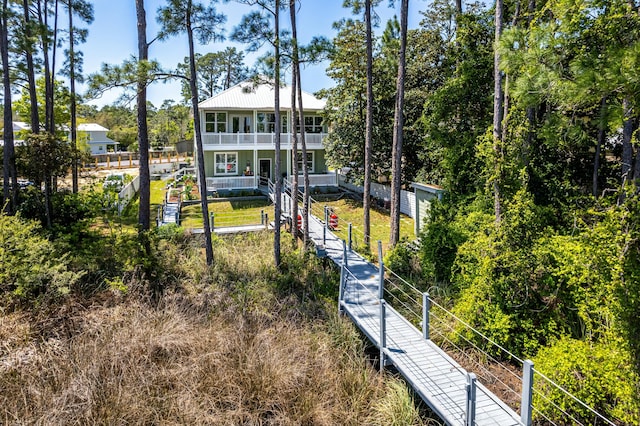 1158 Mack Bayou Rd, Santa Rosa Beach, FL 32459 - rear view of property featuring a porch, a balcony, and a fenced front yard