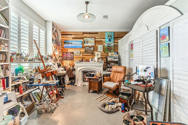 1158 Mack Bayou Rd, Santa Rosa Beach, FL 32459 - misc room with wooden walls, visible vents, and speckled floor