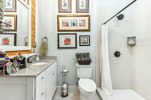 1158 Mack Bayou Rd, Santa Rosa Beach, FL 32459 - bathroom with vanity, baseboards, tile patterned floors, toilet, and a tile shower
