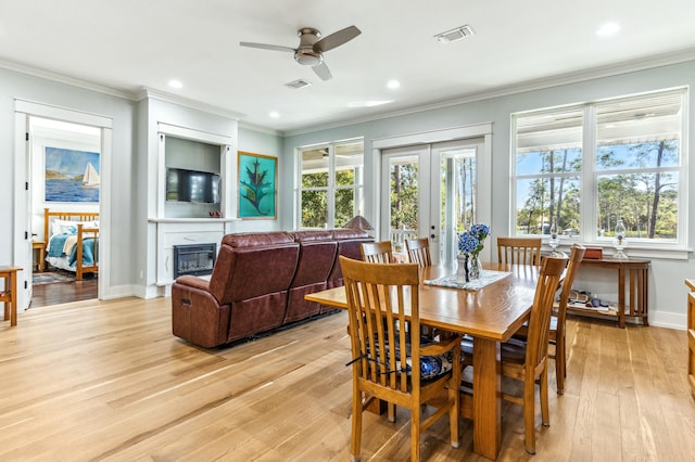 1158 Mack Bayou Rd, Santa Rosa Beach, FL 32459 - dining area featuring ornamental molding, visible vents, light wood-type flooring, and a ceiling fan