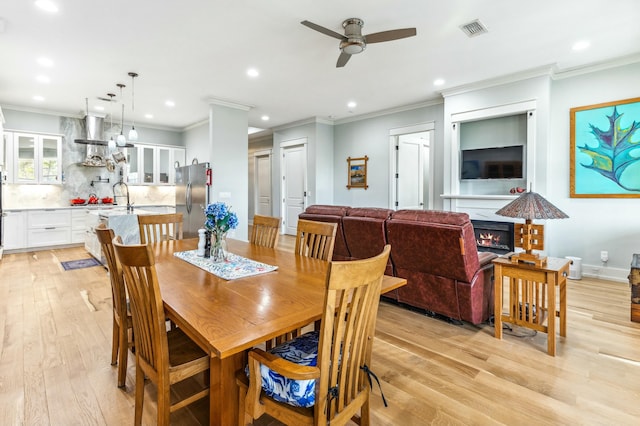 1158 Mack Bayou Rd, Santa Rosa Beach, FL 32459 - dining space with visible vents, ornamental molding, ceiling fan, light wood-style floors, and recessed lighting