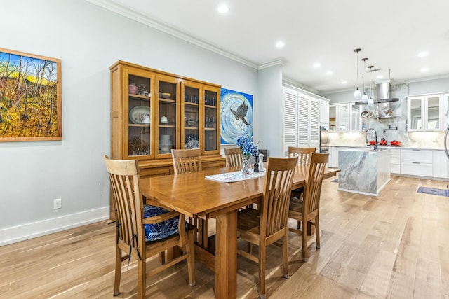 1158 Mack Bayou Rd, Santa Rosa Beach, FL 32459 - dining room featuring recessed lighting, light wood-style flooring, and crown molding