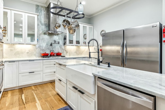 1158 Mack Bayou Rd, Santa Rosa Beach, FL 32459 - kitchen with tasteful backsplash, ornamental molding, light stone counters, white cabinetry, and appliances with stainless steel finishes