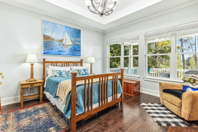 1158 Mack Bayou Rd, Santa Rosa Beach, FL 32459 - bedroom with crown molding, a notable chandelier, baseboards, and hardwood / wood-style flooring