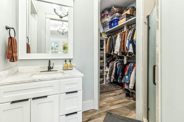 1158 Mack Bayou Rd, Santa Rosa Beach, FL 32459 - walk in closet with an inviting chandelier and a sink