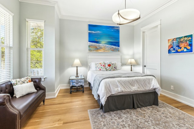 1158 Mack Bayou Rd, Santa Rosa Beach, FL 32459 - bedroom featuring light wood finished floors, baseboards, and ornamental molding