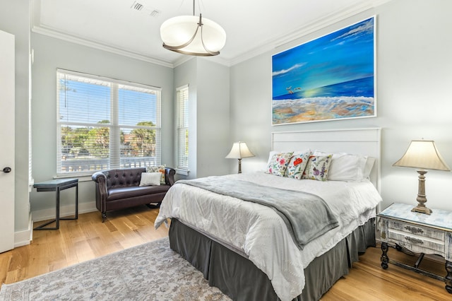 1158 Mack Bayou Rd, Santa Rosa Beach, FL 32459 - bedroom with visible vents, baseboards, crown molding, and wood finished floors