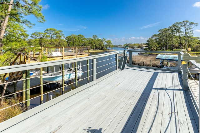 1158 Mack Bayou Rd, Santa Rosa Beach, FL 32459 - wooden deck featuring a dock and a water view