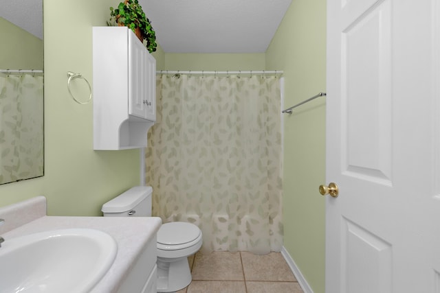full bath with vanity, curtained shower, tile patterned floors, a textured ceiling, and toilet