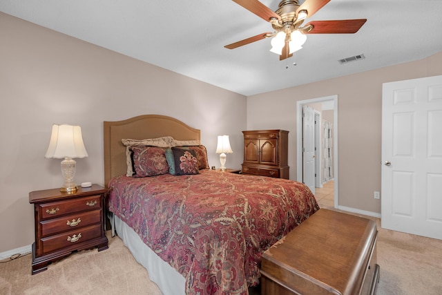 bedroom with light carpet, ceiling fan, baseboards, and visible vents