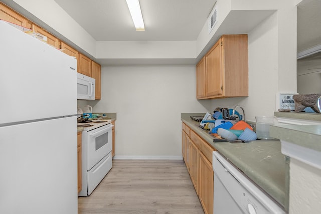 4010 Dancing Cloud Ct Unit 391, Destin, FL 32541 - kitchen with white appliances, light wood-style floors, light countertops, baseboards, and light brown cabinetry