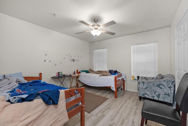 4010 Dancing Cloud Ct Unit 391, Destin, FL 32541 - bedroom with wood finished floors, a ceiling fan, and baseboards