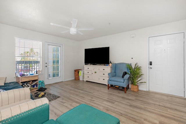4010 Dancing Cloud Ct Unit 391, Destin, FL 32541 - living area with light wood finished floors, a ceiling fan, and baseboards