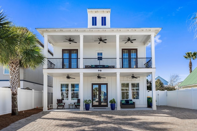 98 Woodward St, Destin, FL 32541 - rear view of house with french doors, fence, and a balcony