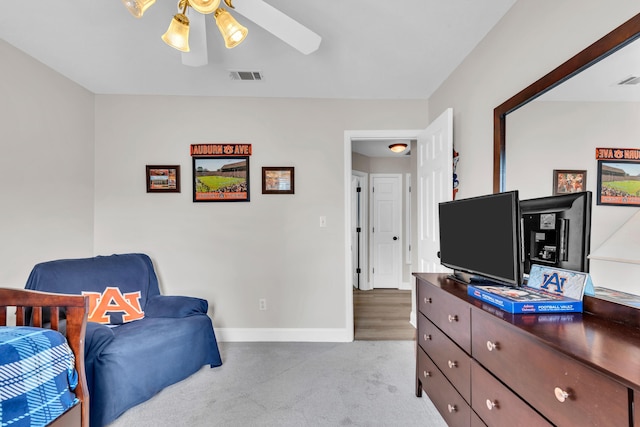 carpeted bedroom featuring baseboards and visible vents