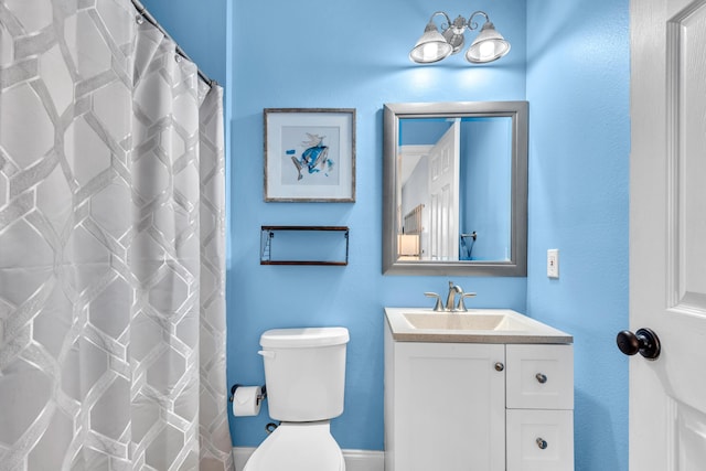 full bathroom with vanity and toilet